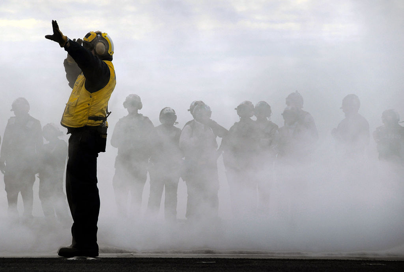 Illustration for article titled Here Is What All Those Colored Shirts Mean On An Aircraft Carrier's Deck